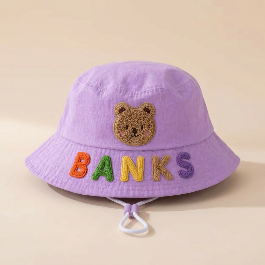 Personalized kids bucket sun hat with custom name letters, clean studio product shot